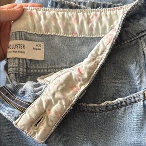 Hollister Women's Low Rise Baggy Blue Jeans. Discontinued pink floral liner